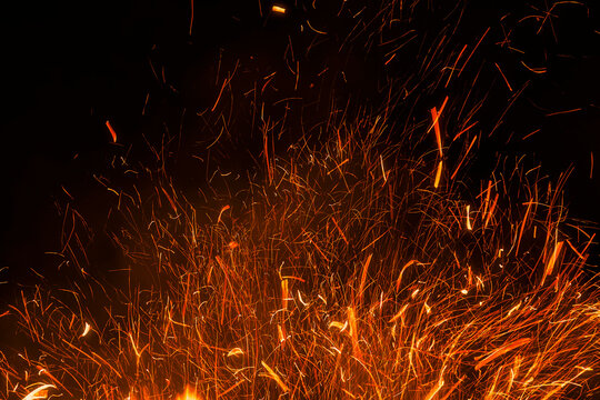 Abstract Flame Texture on a Minimalist Black Background.