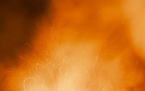 Dreamy Fire Silk Texture Against a Warm Amber Background.