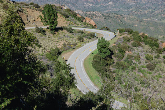Winding Road Through Hills in Daytime Sunlight in California