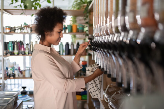 African American woman preparing grain for sell