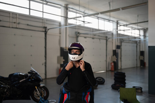 Male Motorcycle racer preparing for competition