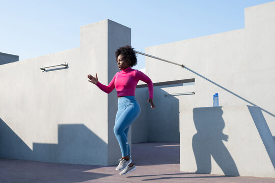 Black female athlete doing run exercise