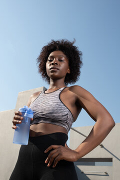 Self assured black sportswoman during break