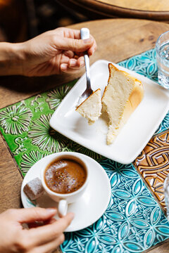 Enjoying Turkish coffee with cheesecake