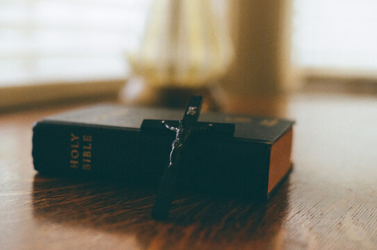 Bible and Crucifix. Selective Focus
