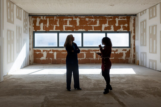 Professional interior designers discussing material for renovation