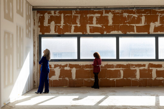 Professional interior designers discussing material for renovation