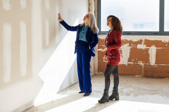 Professional interior designers discussing material for renovation