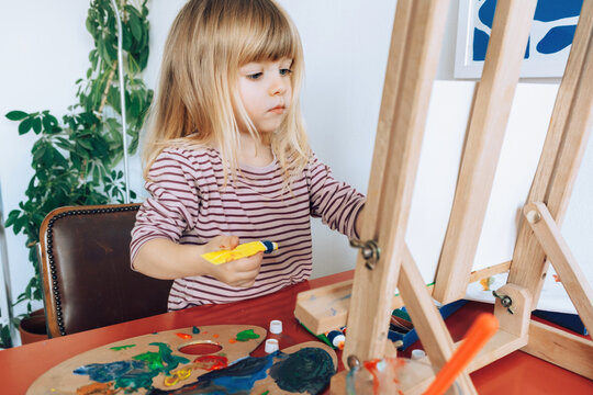 Artist at dining room desk 
