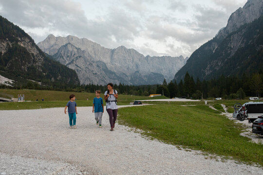 Family after a hike in Slovenia. Mountains in the Background
