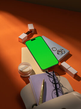 Flat lay of modern woman's essentials with blankscreen smartphone