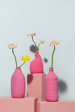 Minimalist pink vases with delicate gerbera daisies