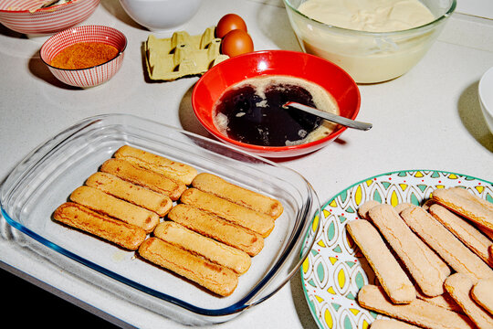the base of a homemade tiramisu with prepared ingredients