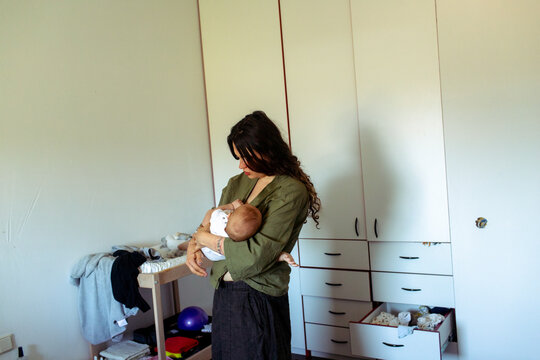 mother breastfeeding baby 