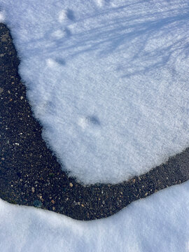 Snow patterns on sidewalk