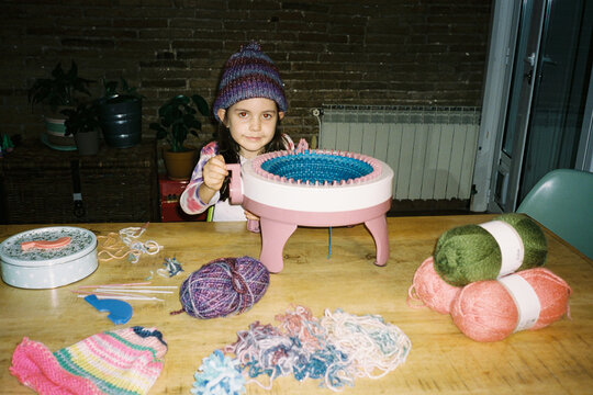 Child Knitting with Yarn Supplies. Handmade. Film
