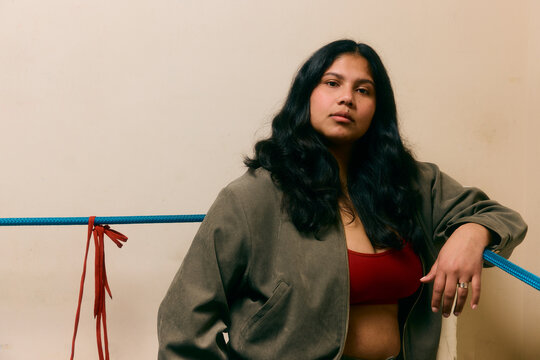 Portrait of a female boxer in the corner of the ring 