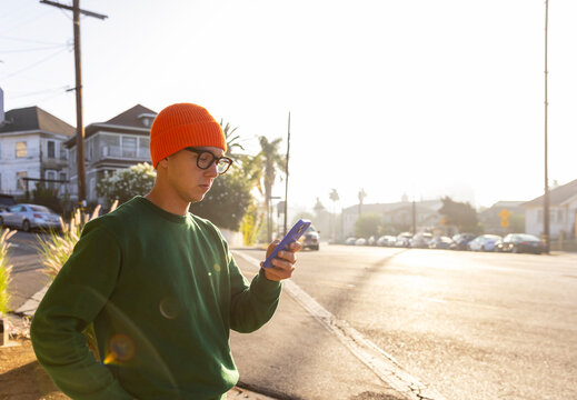 Man use mobile  phone  City hat