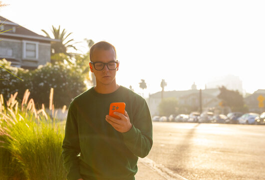 Confident Man use mobile  phone  City 