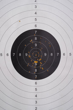Practice at the Shooting Range With a Target Board Showing Marks