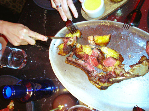 Sharing Steak Dinner at Restaurant Table from Above