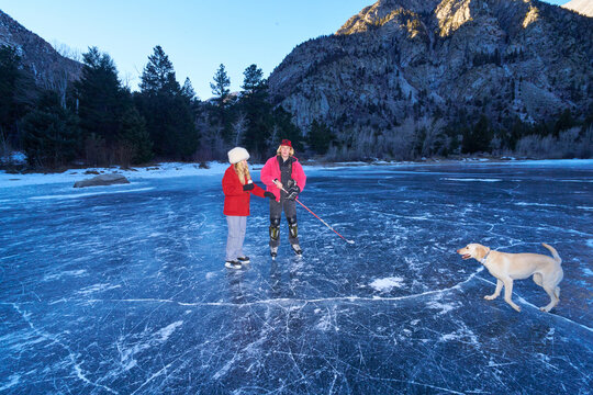 Winter Outdoor Fun With Dog On Natural Ice