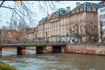 Ancient Stone Bridge Featuring Elegant Arches Along Tranquil Canalscape Reflecting Historic Rooftops © Val MAK
