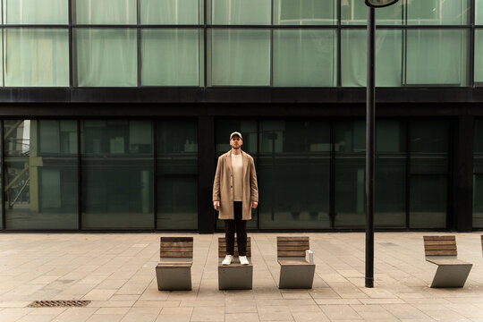 Man Standing On Bench