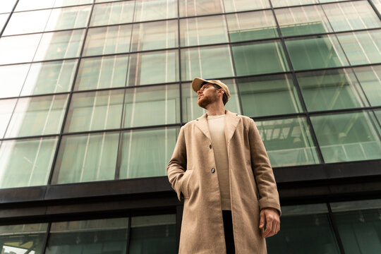 Cofident Man Under Glass Facade