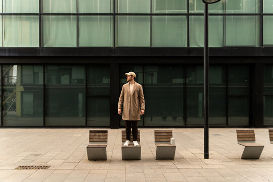 Man Standing On Bench