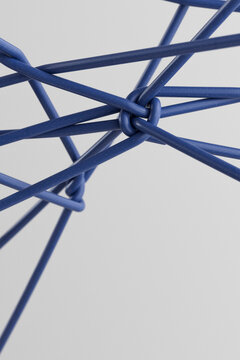 Complex network of interwoven blue tubes