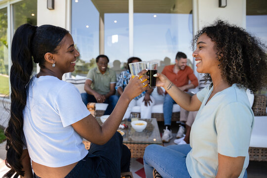 Friends enjoying a backyard gathering with drinks