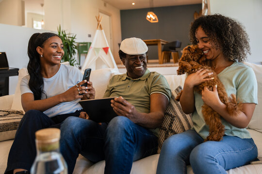 Family enjoying quality time with phone and dog