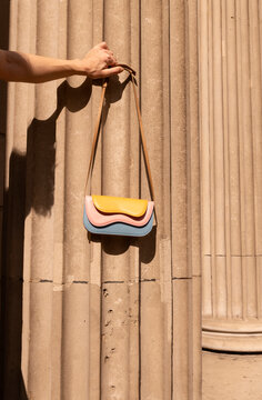 Pastel Color Bag Hanging On Architectural Column