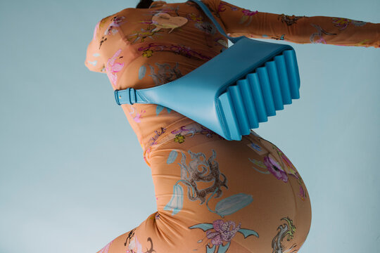 Pregnant Model With Bright Blue Bag