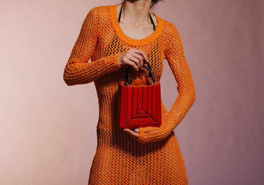 Orange Mesh Dress With Red Geometric Handbag