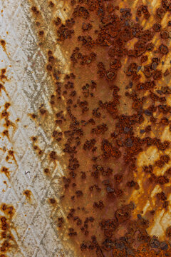 Close-up of rusted metal with textured patterns