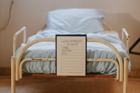 Hospital bed with identification form in a ward