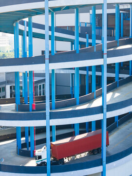 Spiral Ramp at Logistics Warehouse with Semi-Truck