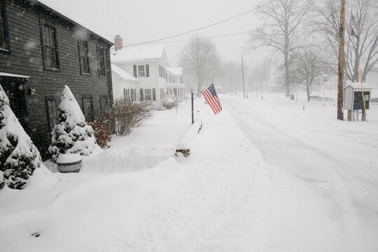 scene during snowstorm in a little town in Massachusetts New England 