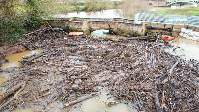 Aerial Shot of Flood debris at Historic Bridge on River