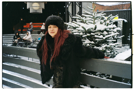 Young girl posing on a skating rink