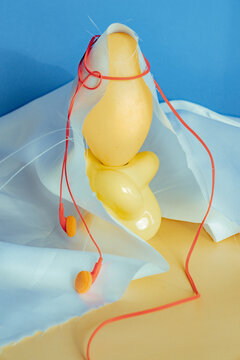 Creative arrangement of yellow objects and headphones on a table
