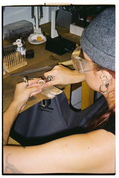 The jeweler makes a silver ring