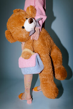 Carefree Kid With Huge Teddy Bear Plush