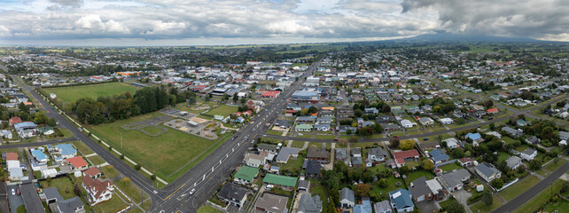 Naklejka premium Aerial view of the town of Statford, Taranaki, New Zealand, showcasing residential areas, a sports field, and a unique traffic education park for children.