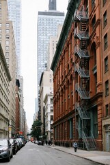 Obraz premium USA old red brick buildings and modern skycrapers AI generated