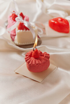 Valentine's Day strawberry desserts with pink candle 