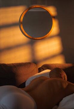 Morning Window Light With Person Resting In a Bed