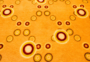 Orange carpet texture background with retro circular geometric pattern © MP